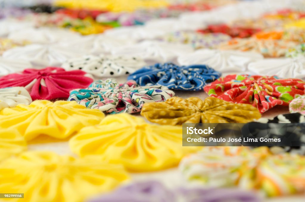 Several pieces of Fuxico sewn together forming a bedspread. handmade. artisanal. craft. colorful. Colored pattern of several fuxicos stitched together. Brazil Stock Photo