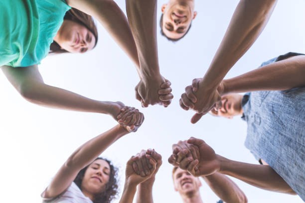 istock Family clasping hands in solidarity 982203756