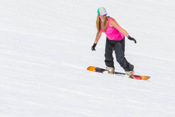 istock Adult Female Snowboarding 982206038