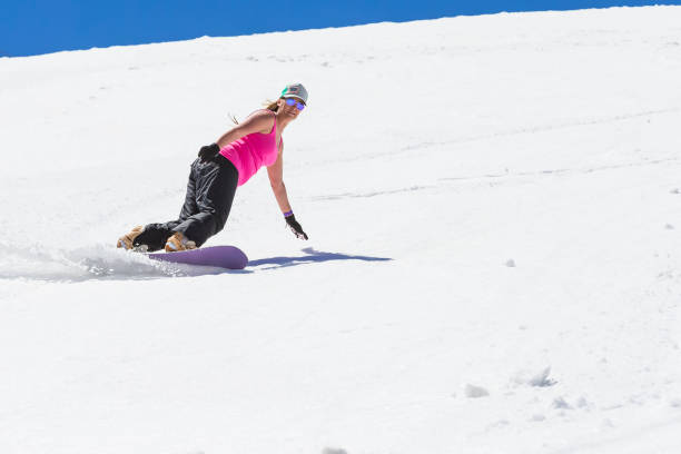 istock Adult Female Snowboarding 982206062