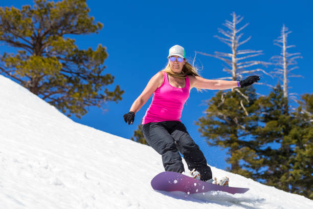istock Adult Female Snowboarding 982206066