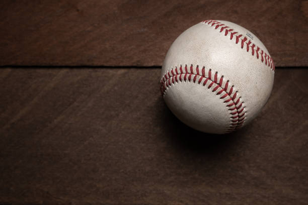 istock Vintage baseball gear on a wooden background 982208894