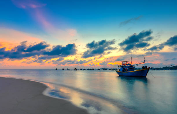 istock Sunset and boat on the sea 982215414