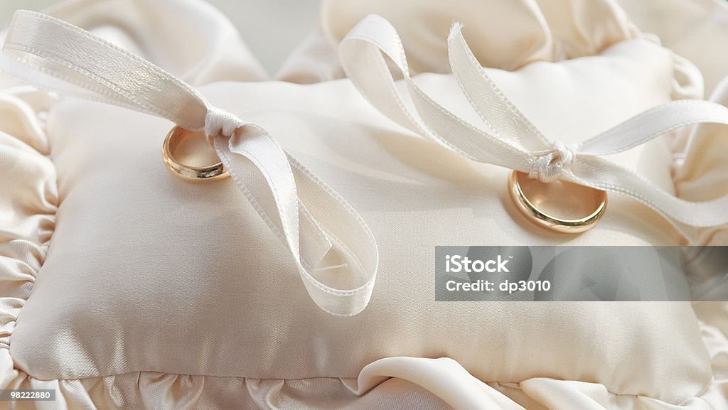 Gold wedding rings  Beige Stock Photo