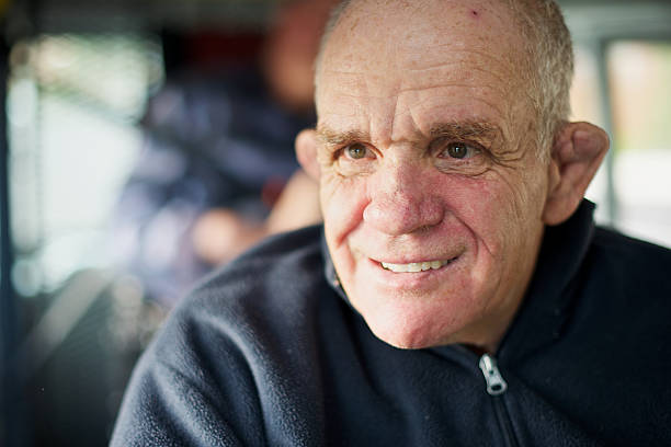 istock Senior man with an intellectual disability caught in window light 98223090