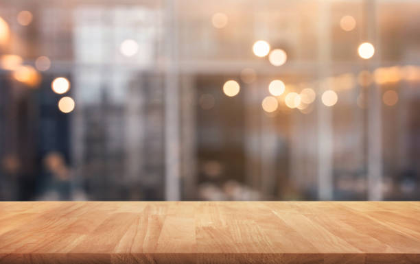 istock Wood table top with light gold cafe,restaurant background 982239412