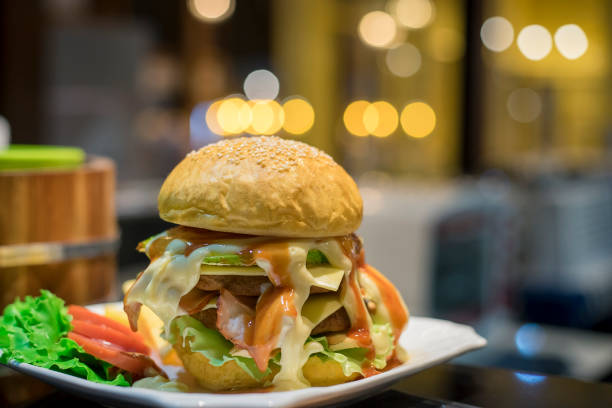 istock Hamburger and fresh vegetable on white plate. 982244644