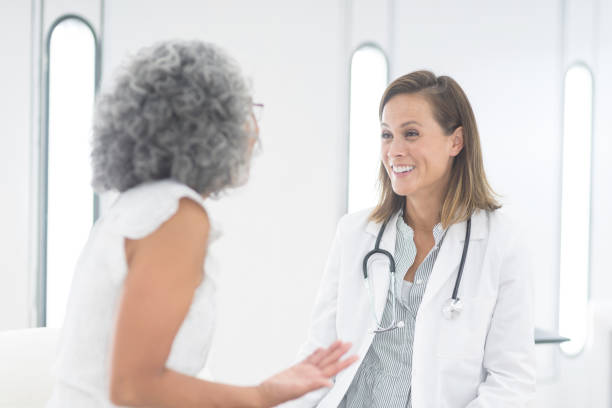 istock Female doctor consults with her patient 982256082