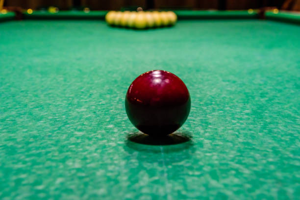 istock Red ball on the green cloth. Russian billiard 982256470