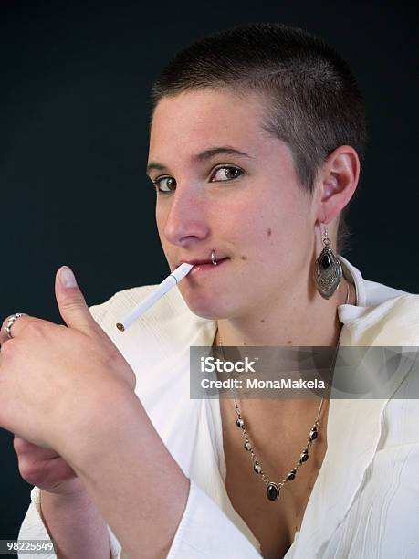 Young Woman Lighting A Cigarette Stock Photo - Download Image Now - Addiction, Adult, Attitude