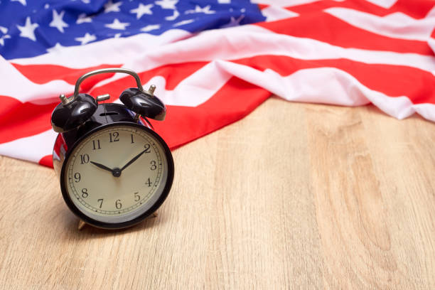 istock USA flag and alarm clock 982258002