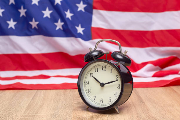 istock USA flag and alarm clock 982258010
