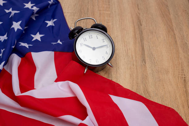 istock USA flag and alarm clock 982258086