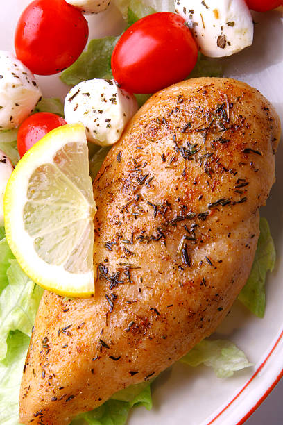istock A piece of grilled chicken surrounded by tomatoes and cheese 98226065