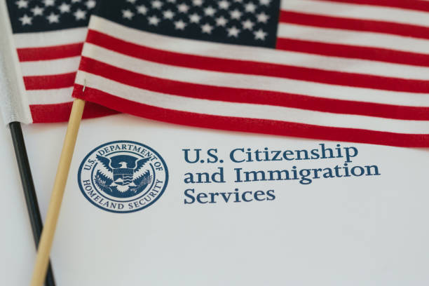 Citizenship and immigration paperworkf US flag and citizenship and immigration paperwork citizenship stock pictures, royalty-free photos & images