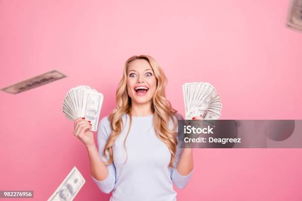 Wow Omg Portrait Of Impressed Glad Girl Having A Lot Of Flying Money Around Her Having Unbelievable Unexpected Reaction Isolated On Pink Background Stock Photo - Download Image Now