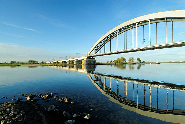Railway bridge over a river  lek river in the netherlands stock pictures, royalty-free photos & images