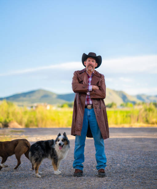 istock Rancher with his dogs 982317410
