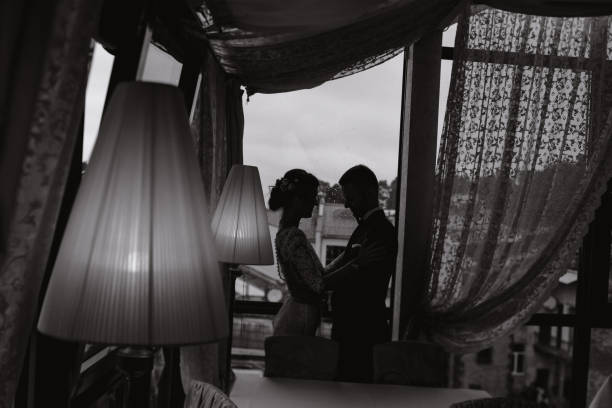 istock groom and bride in a hotel 982336502