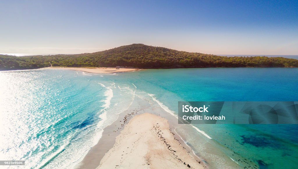 Fingal sand spit as high tide washes in cutting access Fingal spit as the tide washes in.  Port Stephens Australia Port Stephens Stock Photo