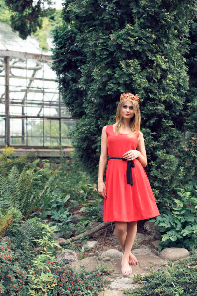 istock Blonde in bright red dress 982359982