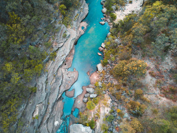 Mountain creek aerial views into valley