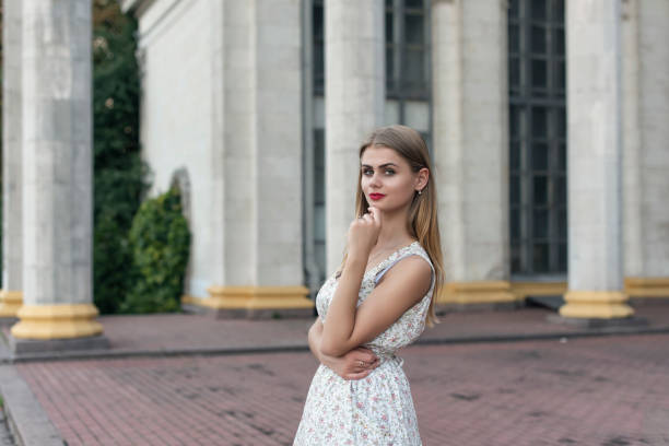 blonde in a summer white dress