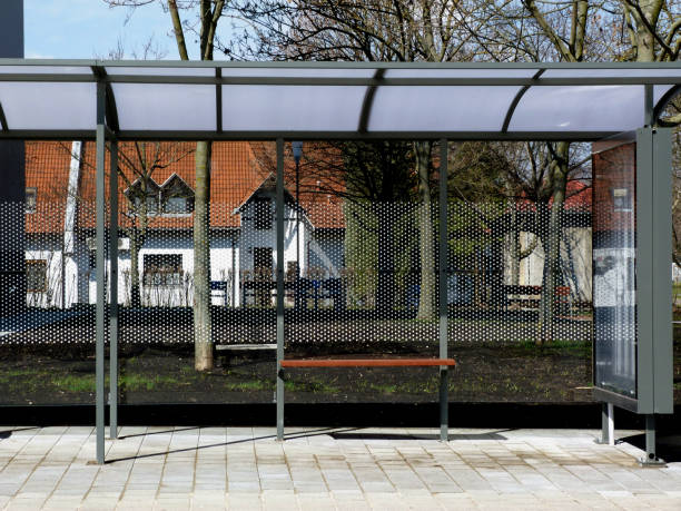 modern bus shelter design in residential neighborhood stock photo