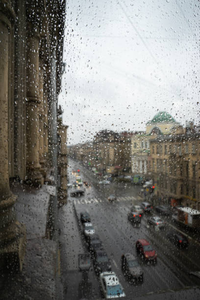 istock Defocussed traffic viewed through a car windscreen covered in rain 982369826