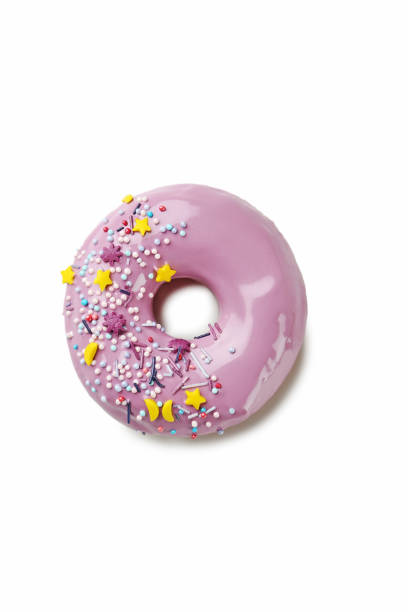 istock Tasty donut with sprinkles isolated on a white 982370564