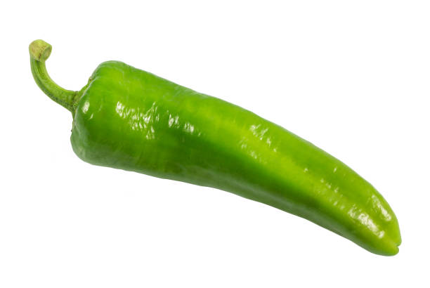 istock Green vegetables. Organic fresh long green peppers or green chilli horizontal isolated on white background, with clipping path. 982374526