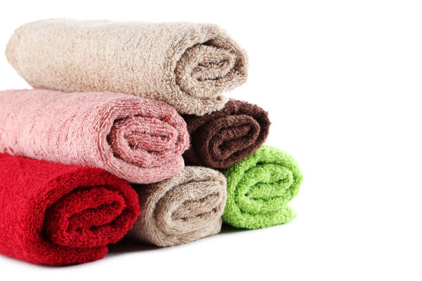 istock Rolled up towels isolated on a white background 982378574