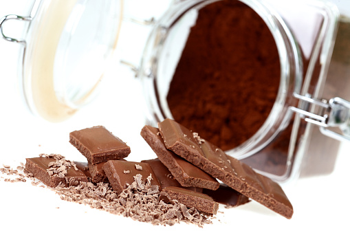 heap of chocolate fragments on a white background