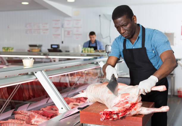 istock Seller preparing meat of lamb 982387540