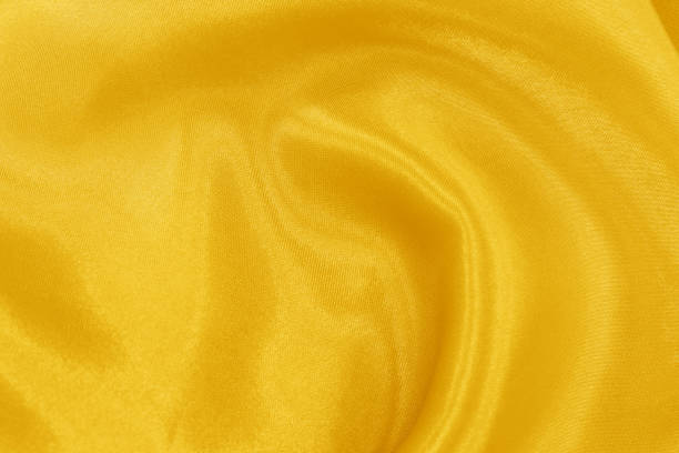 istock Yellow fabric texture for background and design, beautiful pattern of silk or linen. 982387770