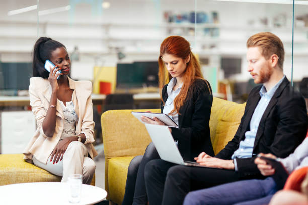 istock Business people conversation. Technology at hand 982389420