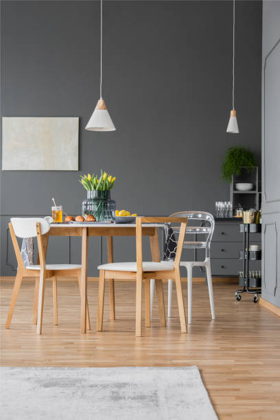 istock Yellow tulips in dining room 982390114