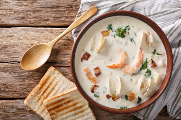 American cuisine: New England clam chowder soup closeup. horizontal top view
