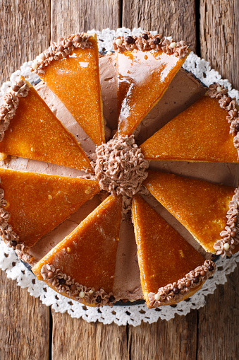 Traditional Hungarian Dobosh cake with caramel decoration macro on a plate. Vertical view from above