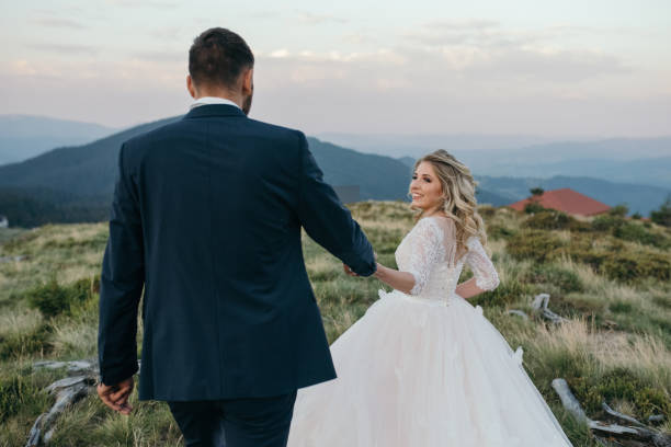 istock A beautiful couple of brides walking outside 982407740