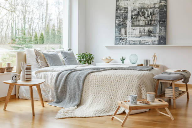 istock Painting in scandi bedroom interior 982413120