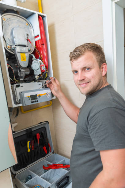 istock Technician repairing Gas Furnace 982418948