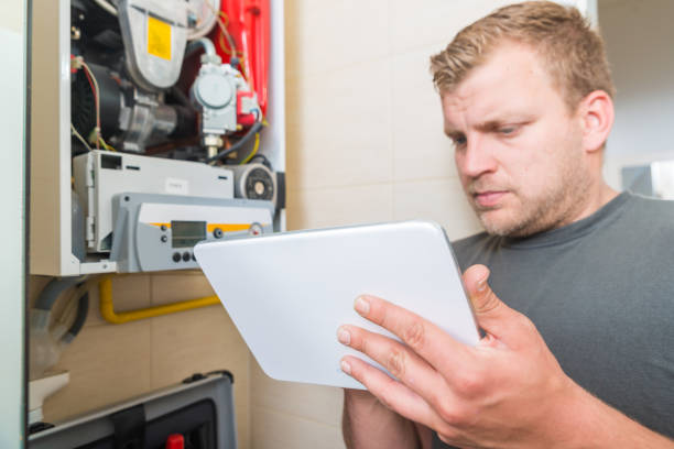 istock Technician repairing Gas Furnace 982418952