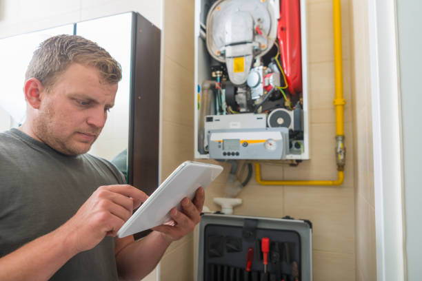 istock Technician repairing Gas Furnace 982418962