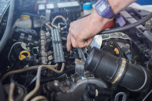 istock Auto mechanic repairing car. Selective focus. 982424384