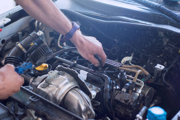 istock Auto mechanic repairing car. Selective focus. 982436894