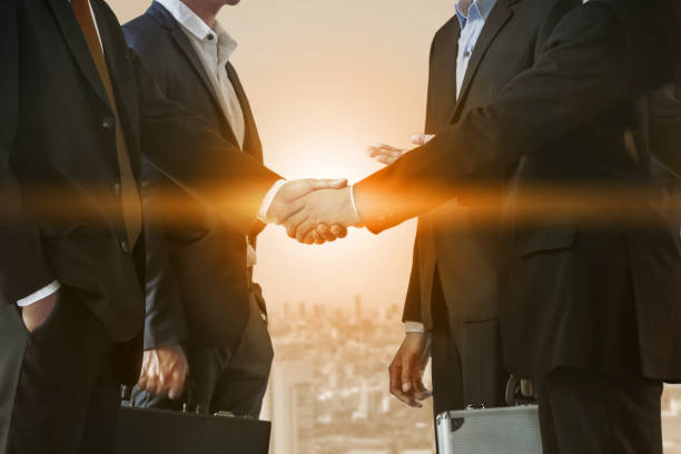 istock Double exposure Business People Handshake Meeting 982437266