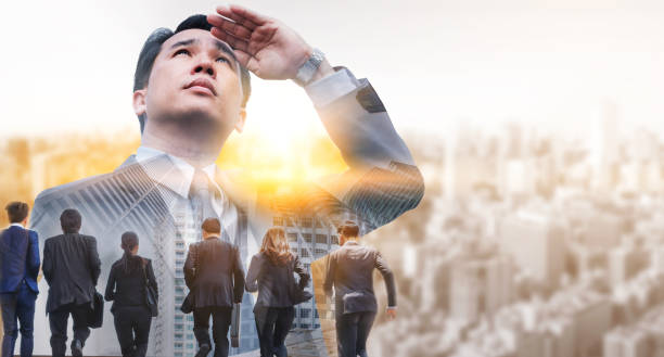 istock Double exposure - Business Leader and Team. 982437276