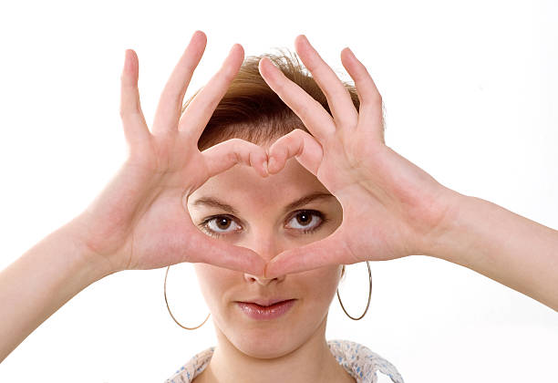 woman represents symbol of heart hands stock photo