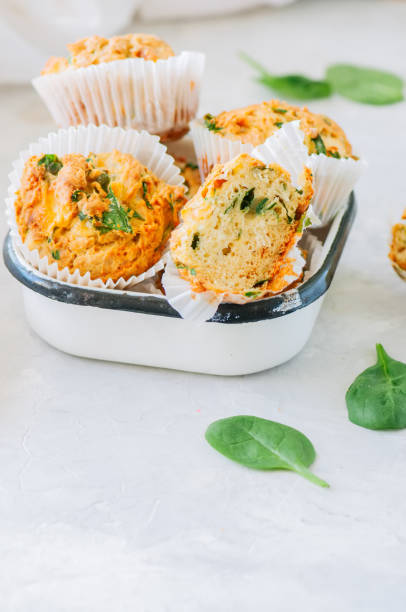 istock Savory potato spinach and feta muffins. White stone background. 982442958
